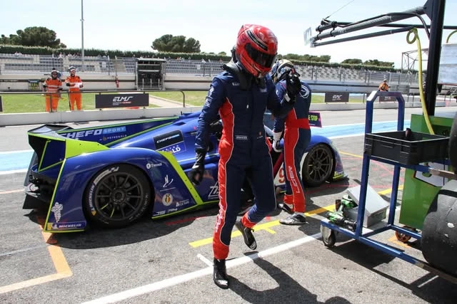 Andrei in the pit lane beside the Ligier JS P4